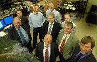 Photographs of Electricite de France (EDF) staff visiting a laboratory with a wave tank in the University of University.